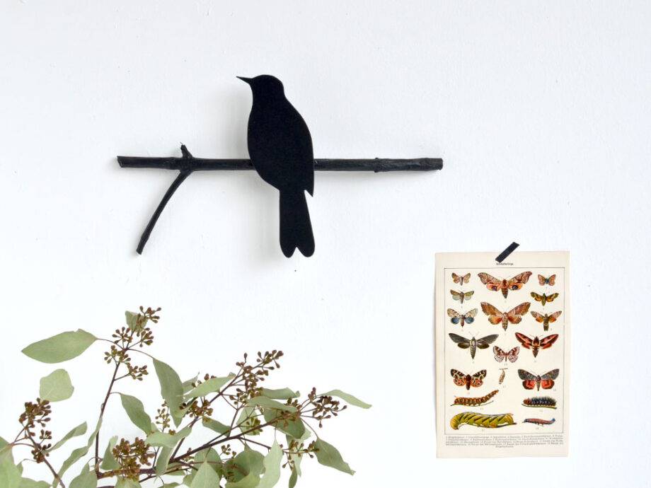 Renna Deluxe Amsel in Fraktur auf dem Ast Vierteljährliche Förderung